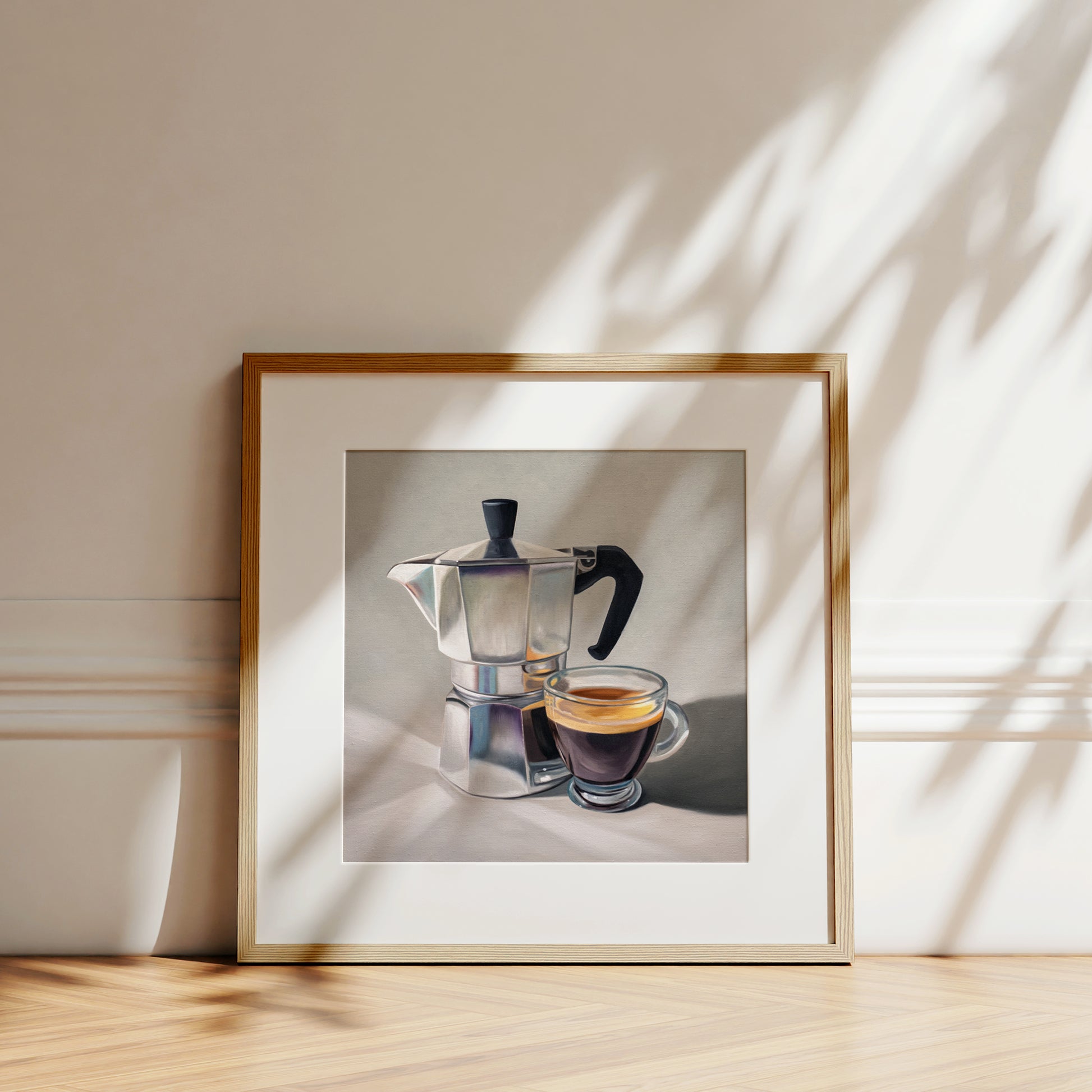 Moka Pot & Espresso Fine Art Print by Lauren Pretorius: a reflective moka pot espresso maker next to a shot of espresso.