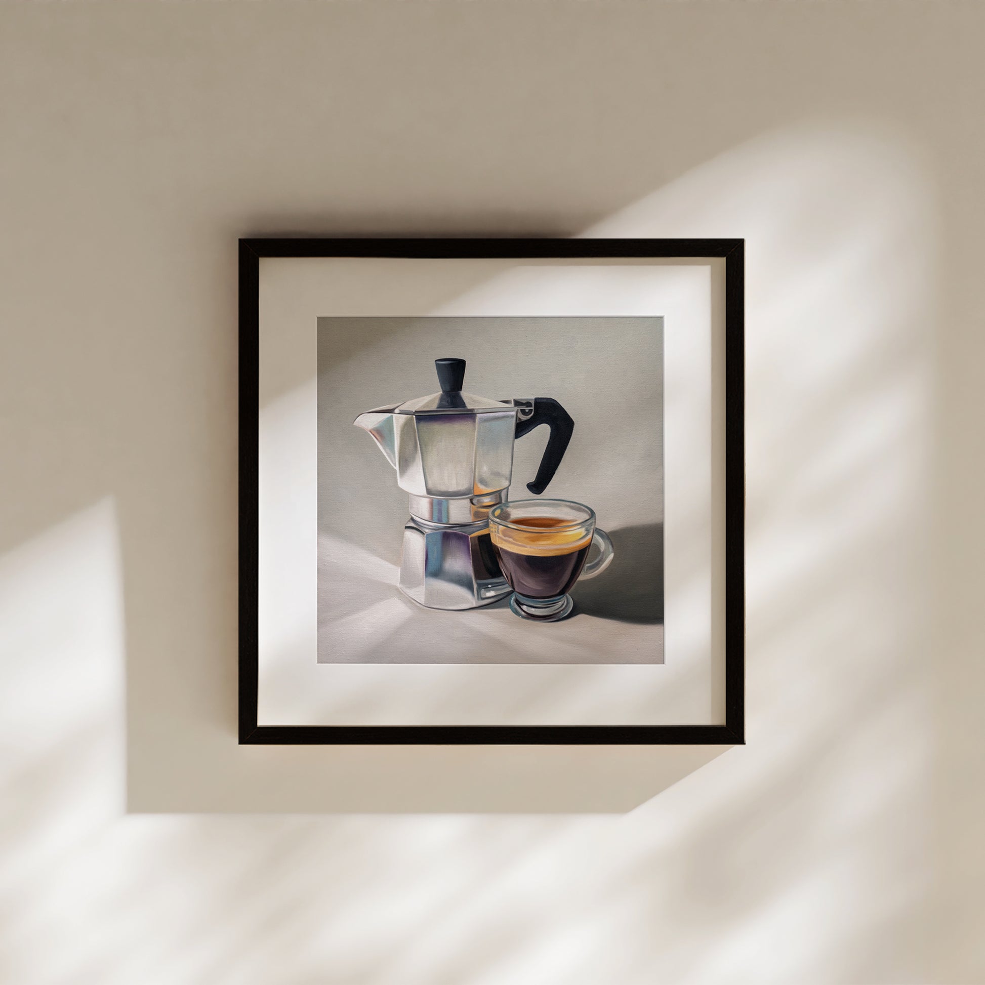Moka Pot & Espresso Fine Art Print by Lauren Pretorius: a reflective moka pot espresso maker next to a shot of espresso.