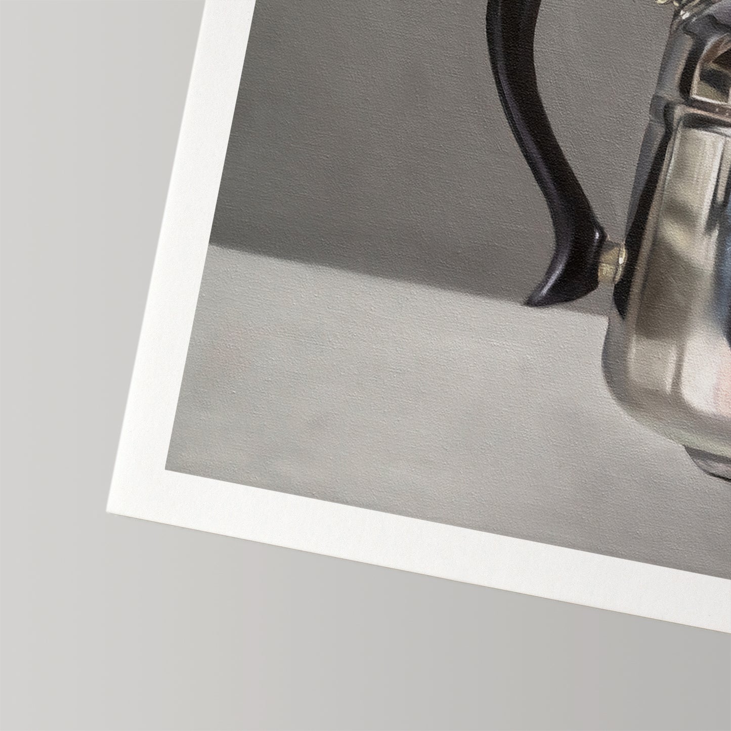 Fine art print of a silver kettle with a black handle, featuring a white border on museum-grade cotton rag paper.