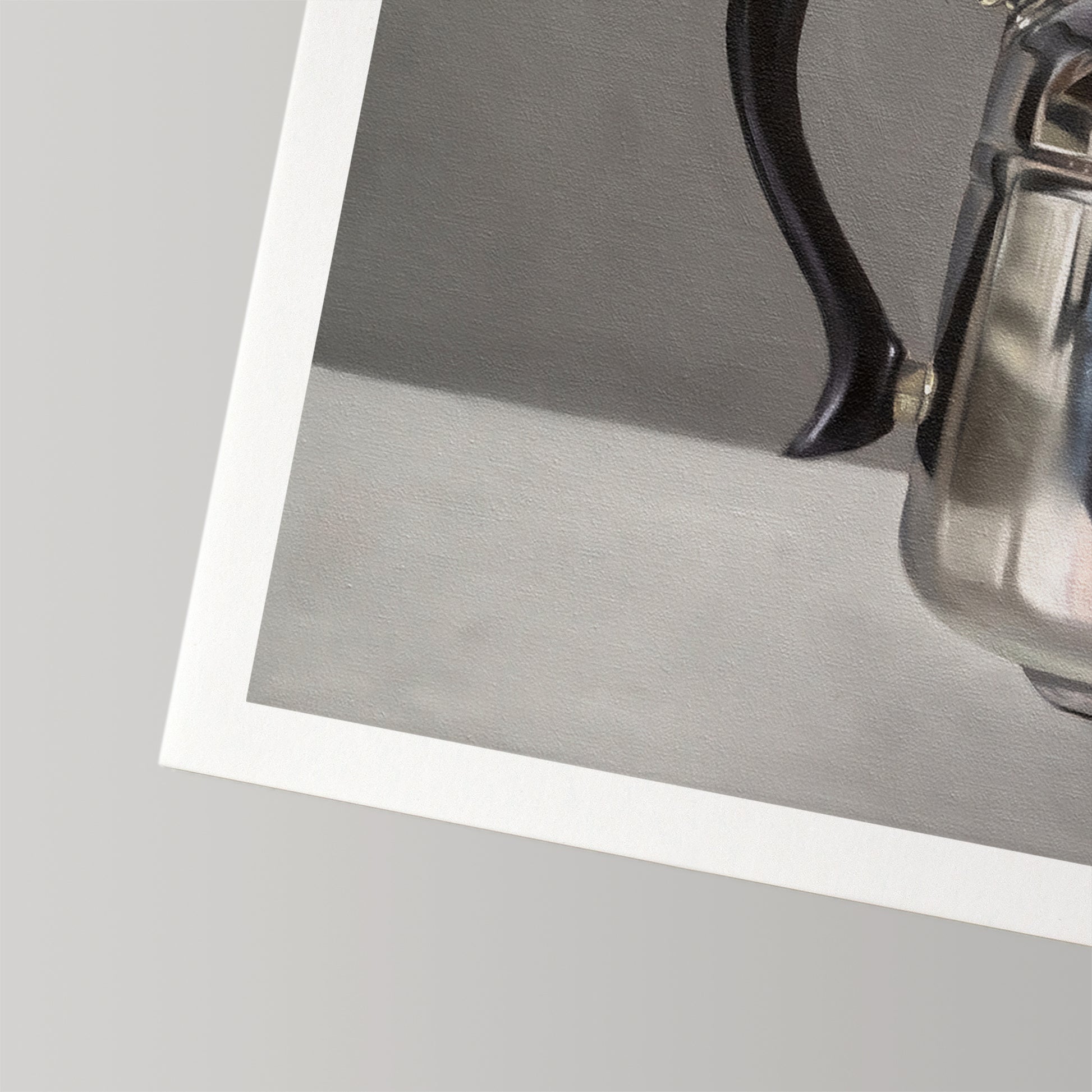Fine art print of a silver kettle with a black handle, featuring a white border on museum-grade cotton rag paper.