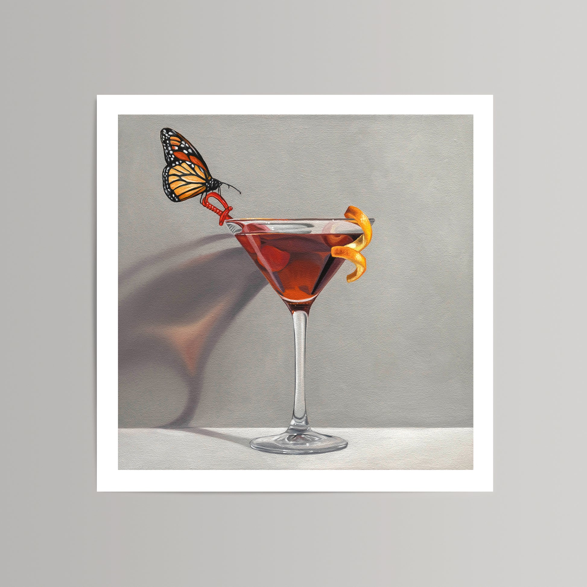 Fine art print of a monarch butterfly perched on a red high heel in a martini glass with an orange peel.