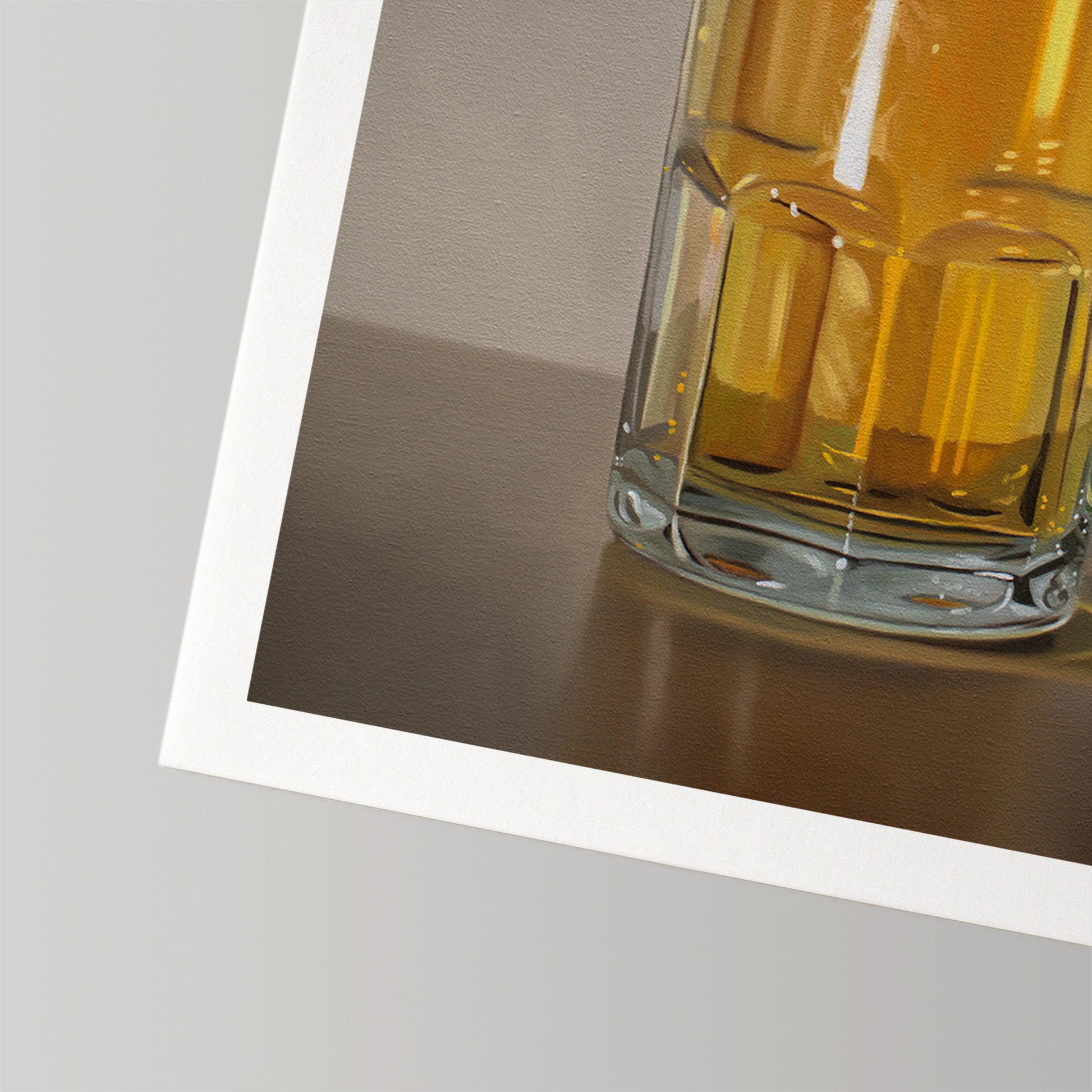 Fine art print of a golden beer in a clear glass mug with a white border.