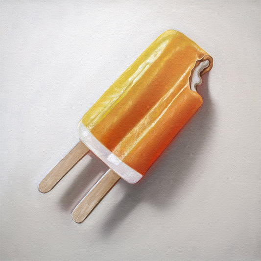 Vibrant fine art print of an orange and yellow dreamsicle popsicle with a bite taken out, on a white background.
