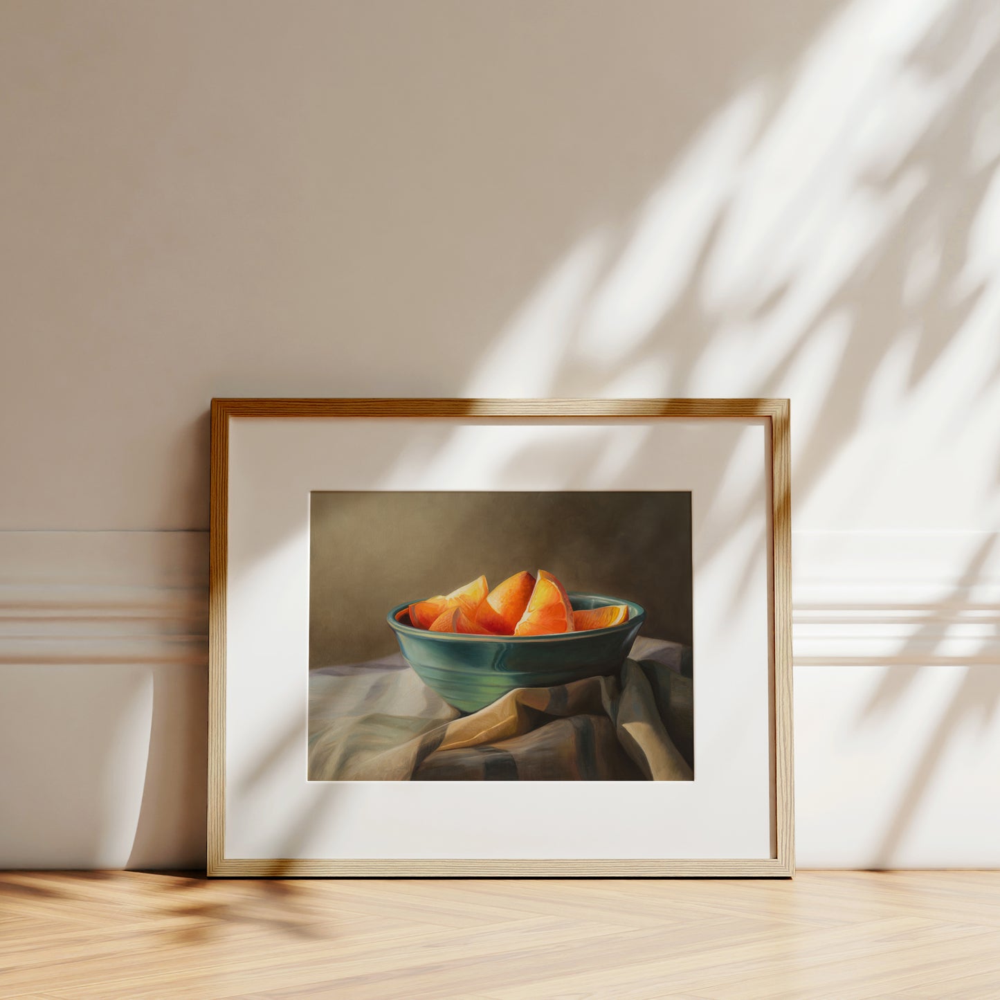 Orange Slices Fine Art Print by Lauren Pretorius: a bowl of orange slices placed on a checkered cloth.