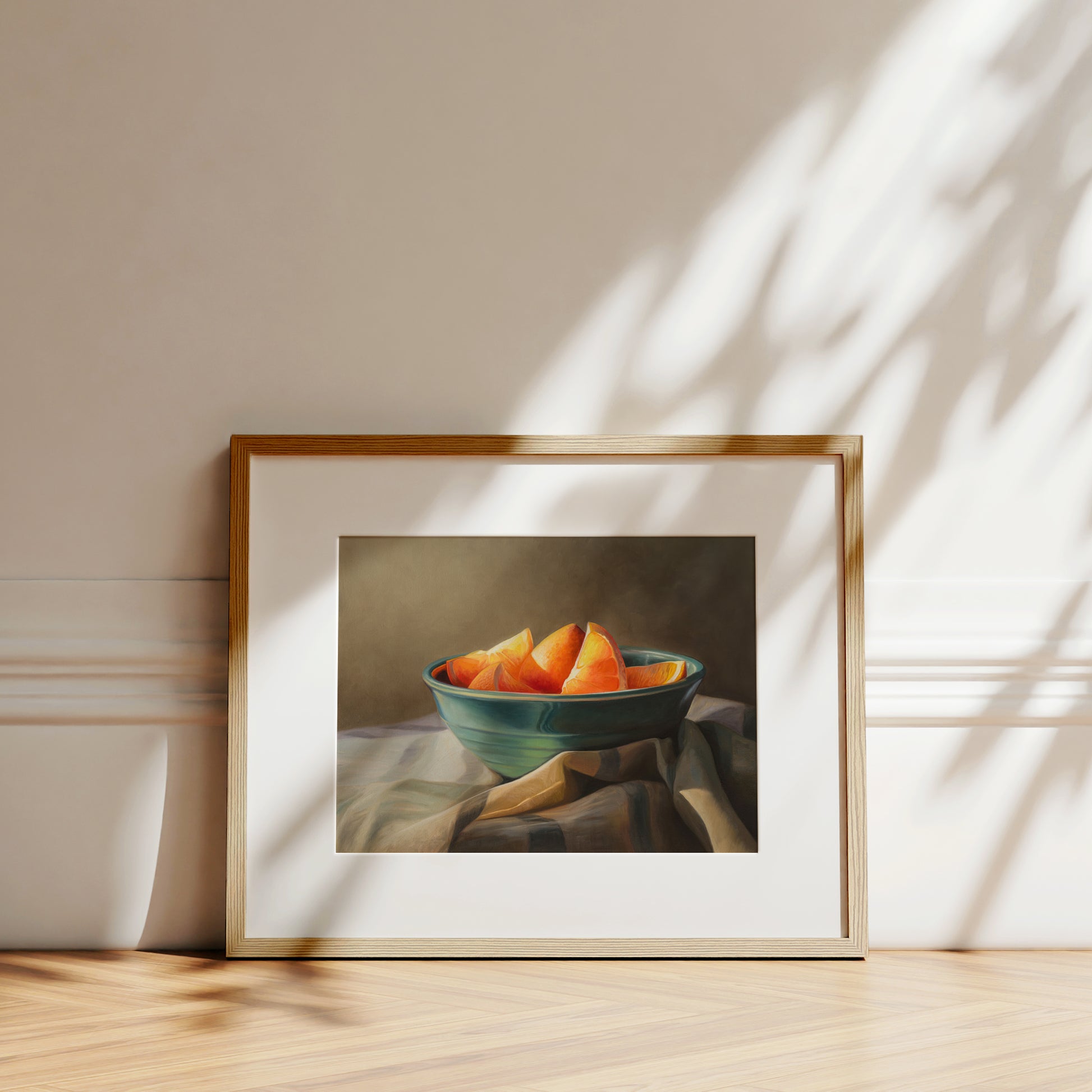 Orange Slices Fine Art Print by Lauren Pretorius: a bowl of orange slices placed on a checkered cloth.