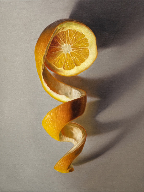 Orange Twist Fine Art Print by Lauren Pretorius: a freshly sliced orange with its peeling spiraling in a downward fashion with dramatic side-lighting creating interesting cast shadows.