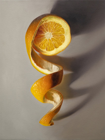 Orange Twist Fine Art Print by Lauren Pretorius: a freshly sliced orange with its peeling spiraling in a downward fashion with dramatic side-lighting creating interesting cast shadows.
