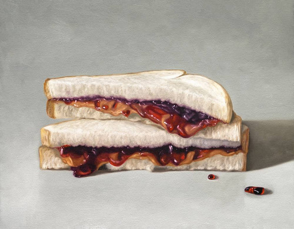 Sandwich with peanut butter and jelly on a gray background