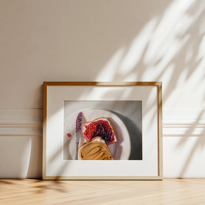 Peanut Butter and Jelly Sandwich Fine Art Print by Lauren Pretorius: a peanut butter and jelly sandwich, depicted with oil paints on a white plate with a knife and a dollop of peanut butter visible.