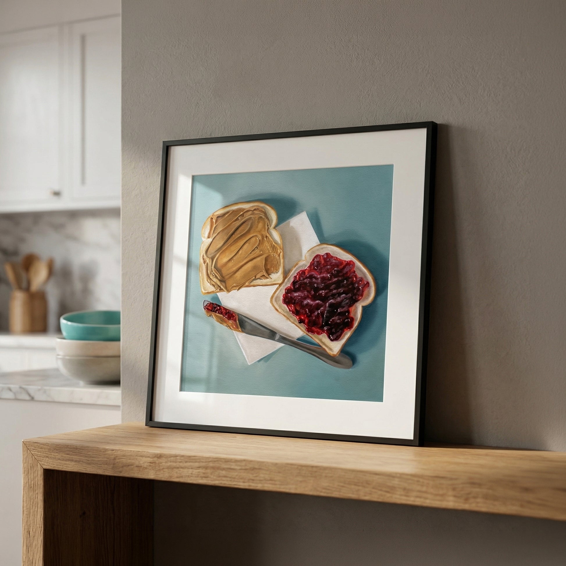 Framed fine art print of two toast slices, one with peanut butter, one with jelly, on a blue background.