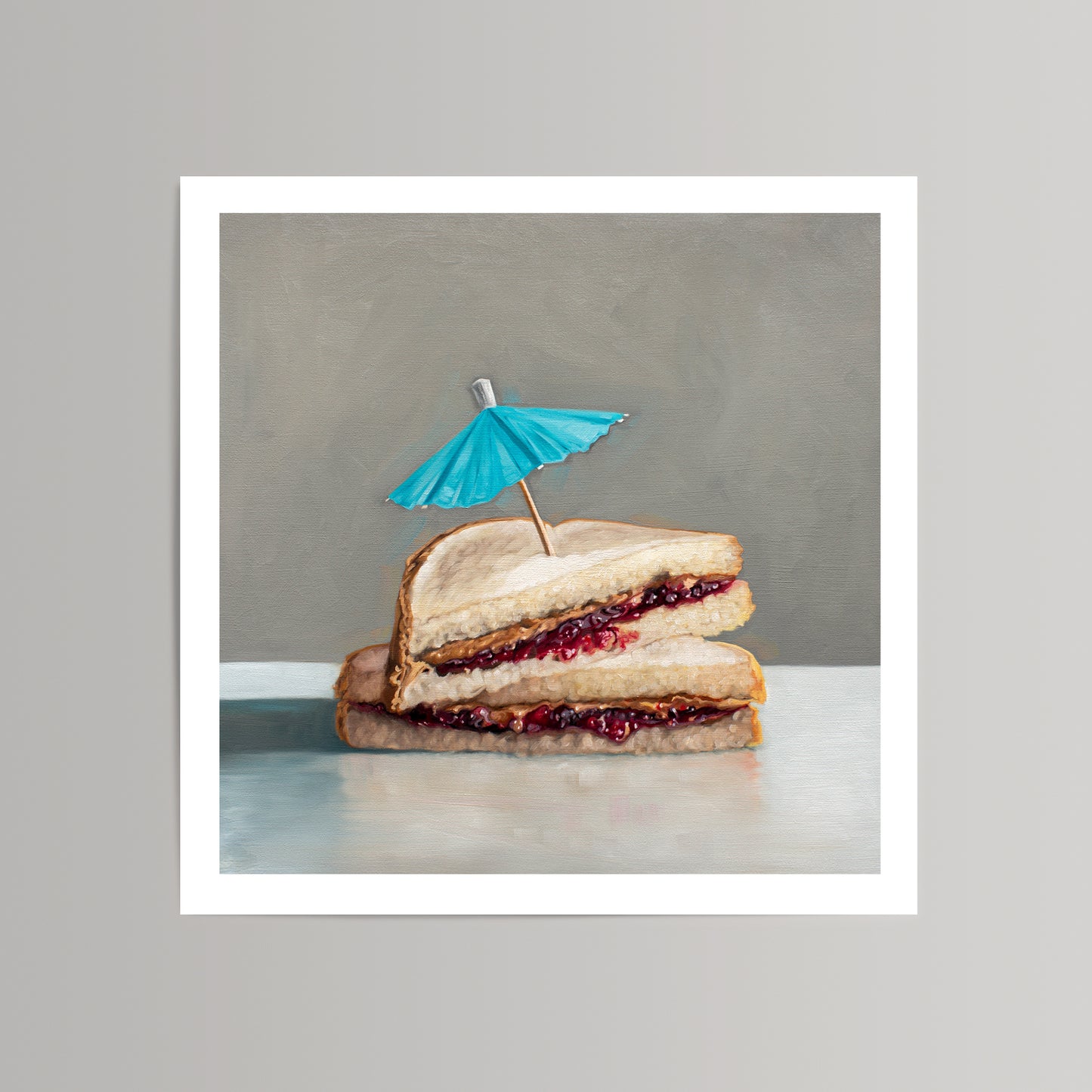 Fine art print of a stacked peanut butter and jelly sandwich with a blue cocktail umbrella.