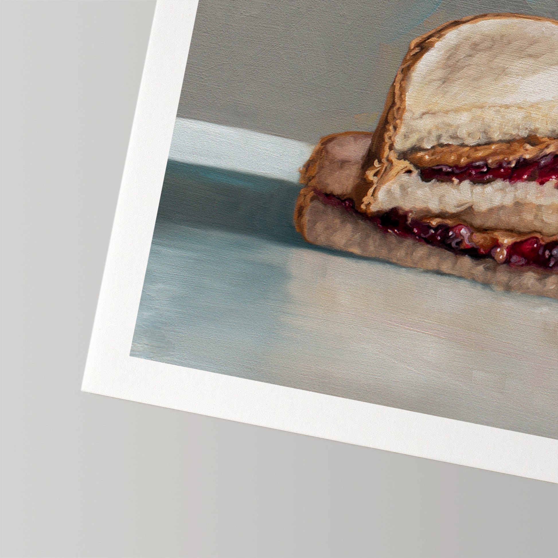 Fine art print of a peanut butter and jelly sandwich with a white border, printed on cotton rag paper.
