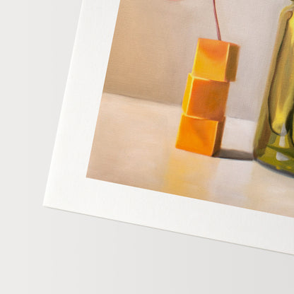 Pickles and Cheese Fine Art Print by Lauren Pretorius: a glass jar of pickles alongside a stack of cheese cubes relaxing under a drink umbrella.