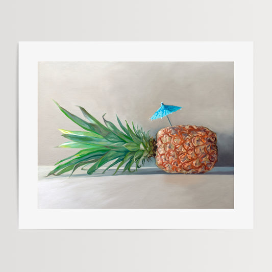Pineapple Paradise Fine Art Print by Lauren Pretorius: a sideways resting pineapple with a blue tropical drink umbrella on top.