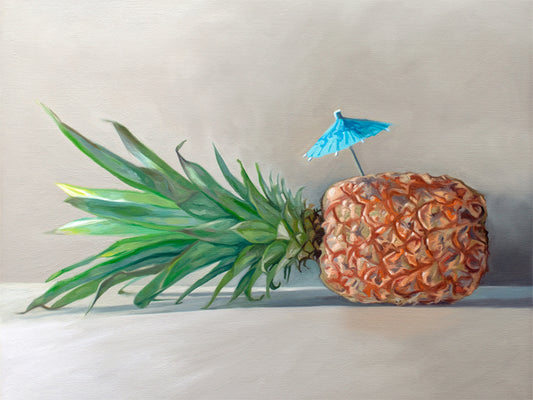 Pineapple Paradise Fine Art Print by Lauren Pretorius: a sideways resting pineapple with a blue tropical drink umbrella on top.