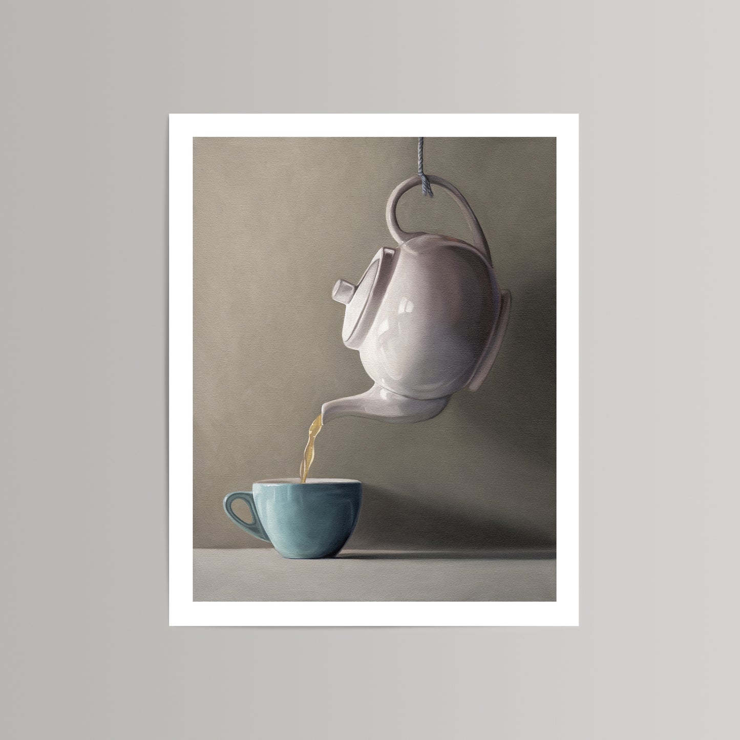 Fine art print of a white teapot pouring golden tea into a teal cup, against a neutral background.