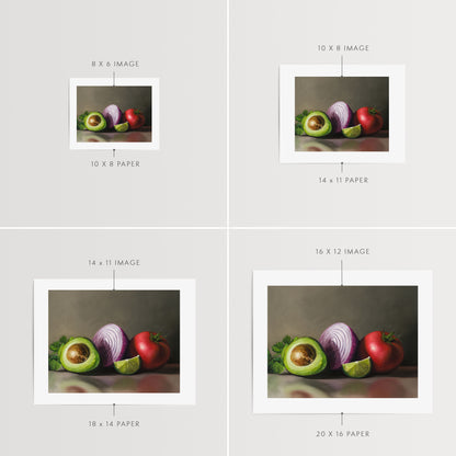 Pre - Guacamole Fine Art Print by Lauren Pretorius: a still life setup with a halved avocado, a red onion, a slice of lime, and a whole tomato on a reflective surface.