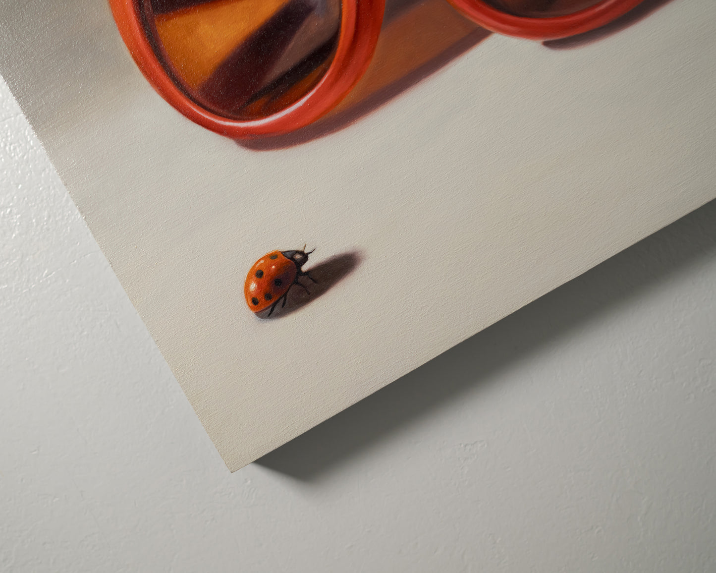 Red Ladies Trio 14" x 11" Original Oil Painting by Lauren Pretorius: red sunglasses with a reflective surface, two ladybugs on and around them against a neutral background.