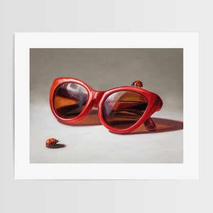 Red Ladies Trio Fine Art Print by Lauren Pretorius: red sunglasses with a reflective surface, two ladybugs on and around them against a neutral background.