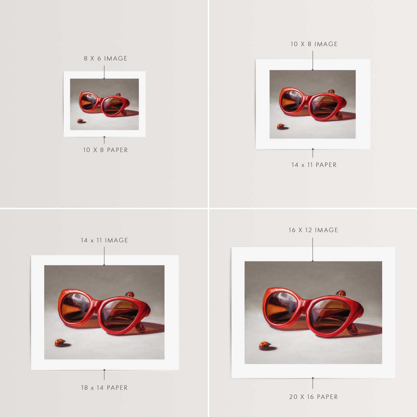 Red Ladies Trio Fine Art Print by Lauren Pretorius: red sunglasses with a reflective surface, two ladybugs on and around them against a neutral background.