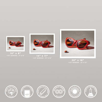 Three "Red Ladies Trio" art prints in varying sizes, featuring vibrant red sunglasses and ladybugs on museum-grade cotton rag paper.