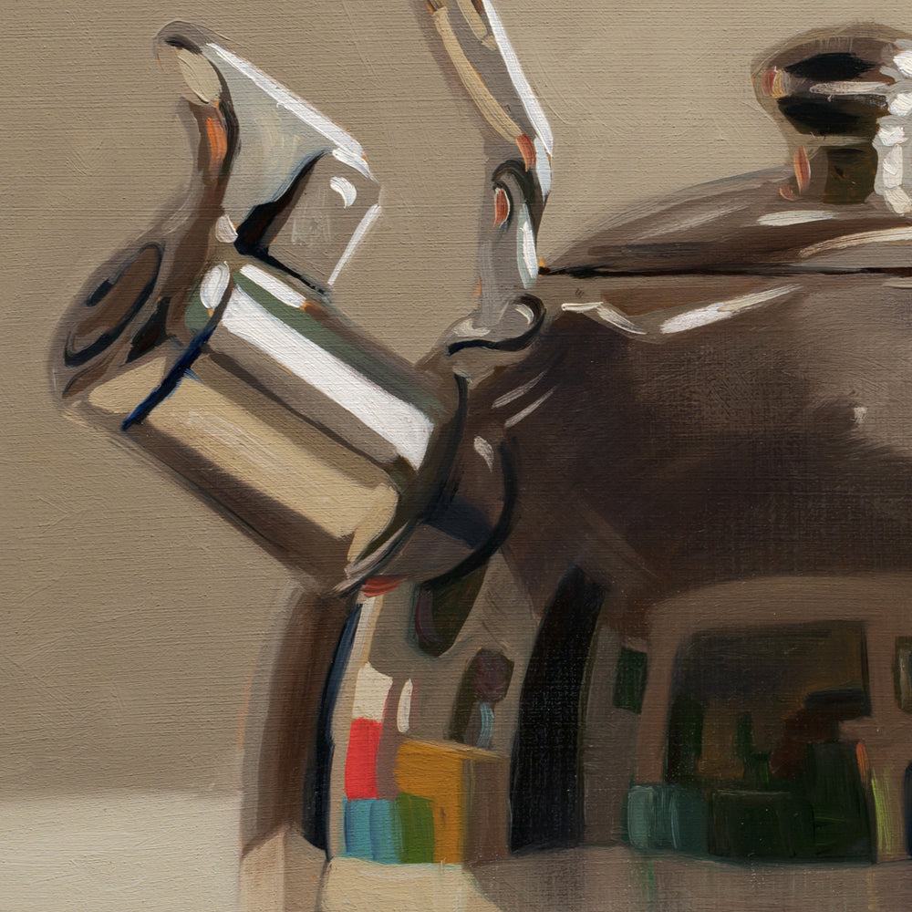 Close-up of a metallic object with a textured background