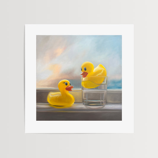 Rubber Ducky Pool Time Fine Art Print by Lauren Pretorius: a pair of yellow rubber duckies enjoying a swim in their pool, which in their case happens to be a glass of water!