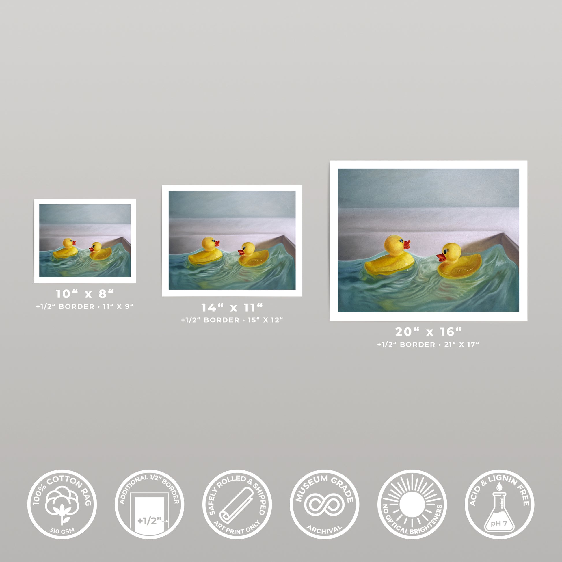 Three art prints of varying sizes, each depicting yellow rubber ducks in a blue bath.