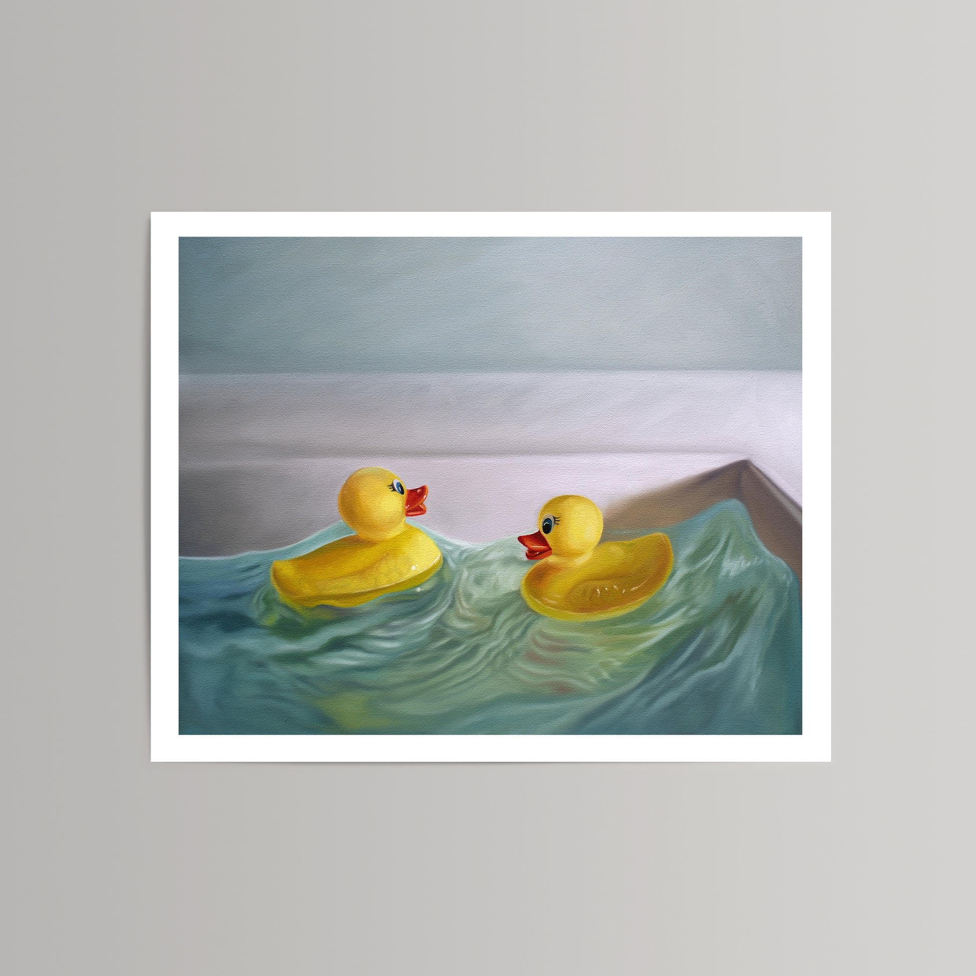 Fine art print of two yellow rubber duckies in a bathtub with blue-green water, white border.