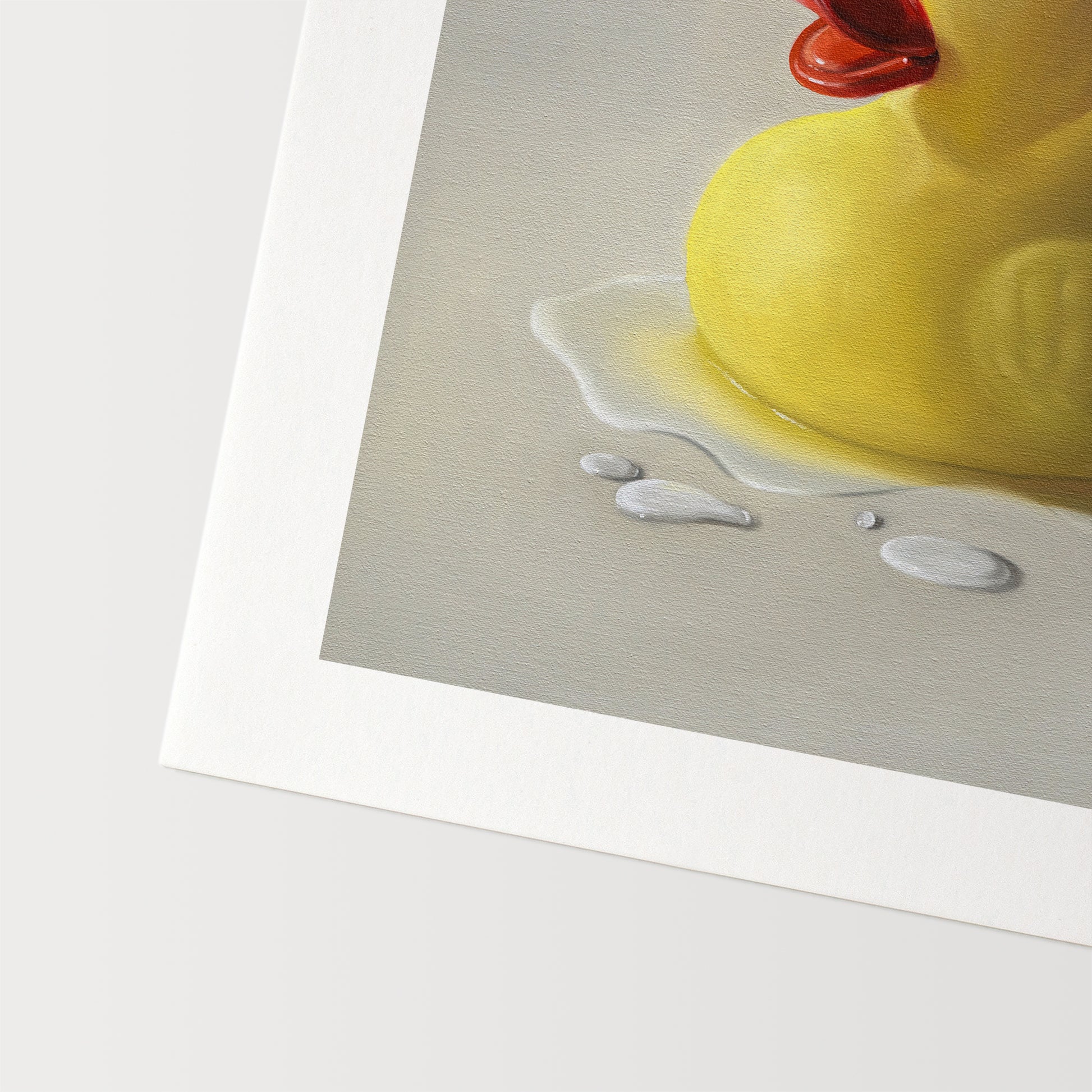 Rubber Ducky Splash Fine Art Print by Lauren Pretorius: a rubber ducky resting on a light surface surrounded by water droplets with some nice dramatic lighting.