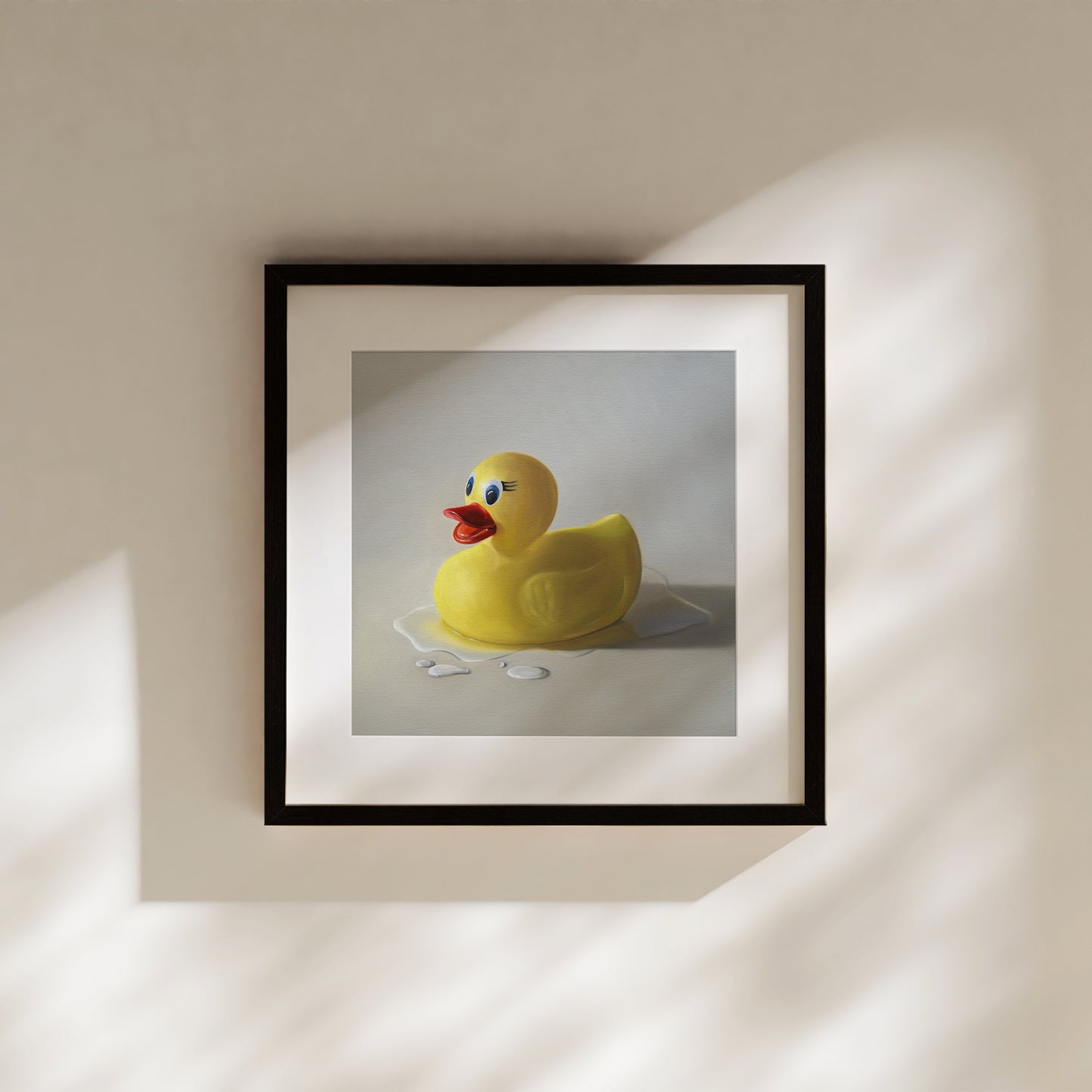 Rubber Ducky Splash Fine Art Print by Lauren Pretorius: a rubber ducky resting on a light surface surrounded by water droplets with some nice dramatic lighting.