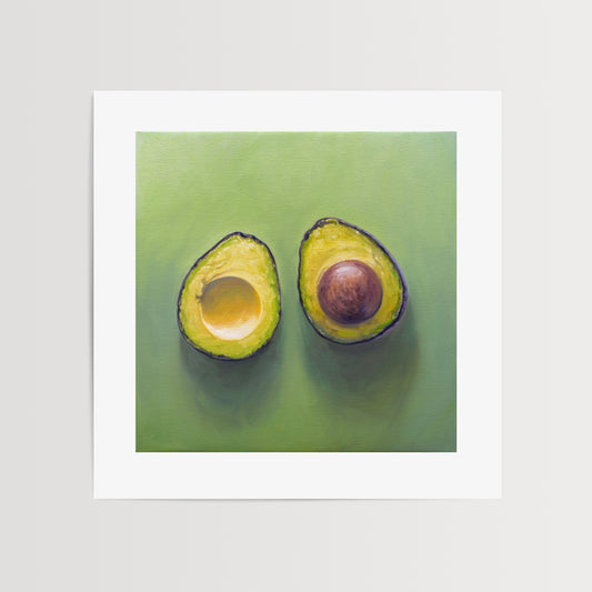 Sliced Avocado Fine Art Print by Lauren Pretorius: a freshly sliced avocado resting on a matching green surface with some nice dramatic lighting.
