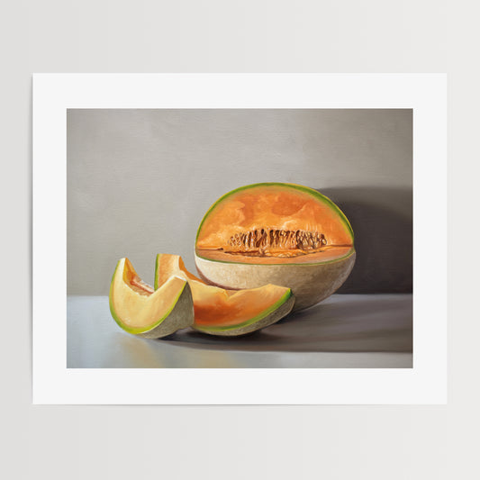 Sliced Cantaloupe Melon Fine Art Print by Lauren Pretorius: a freshly sliced cantaloupe resting on a light grey surface with some nice dramatic lighting.