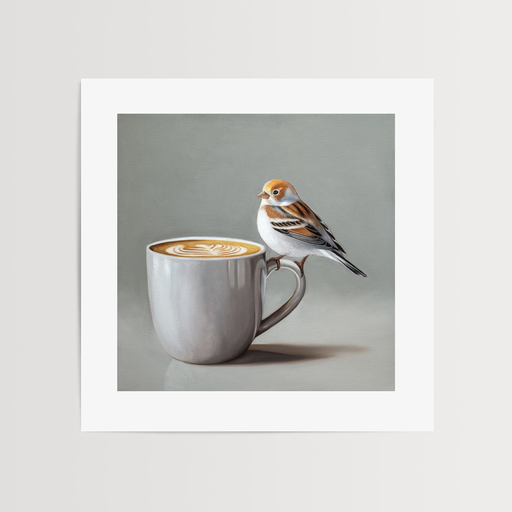 Snow Bunting & Latte Fine Art Print by Lauren Pretorius: a snow bunting perched on the handle of a white cup of coffee.