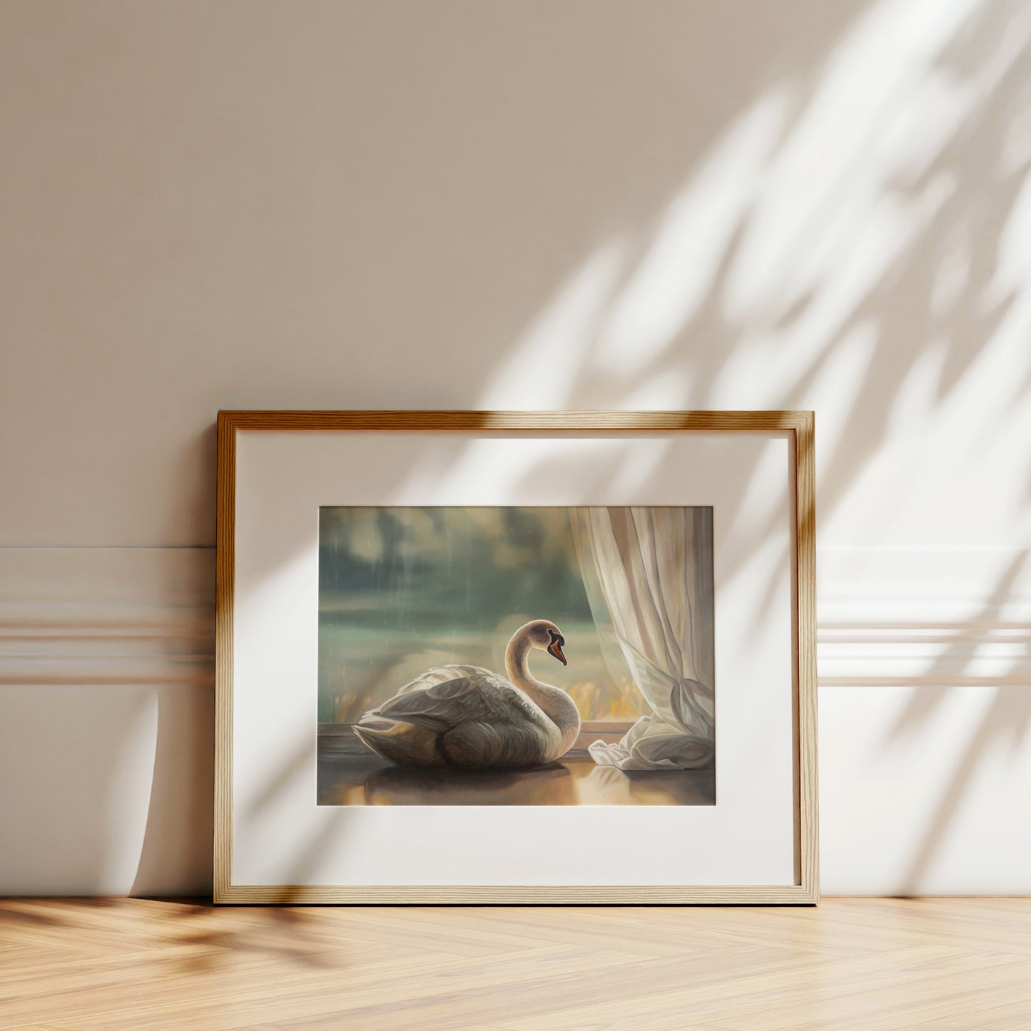 Framed fine art print of a solitary white swan by a window, with soft light and a subtle white border.