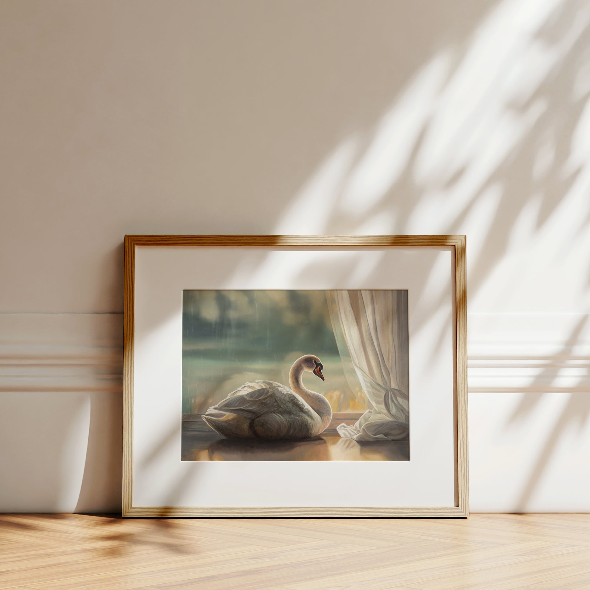 Framed fine art print of a solitary white swan by a window, with soft light and a subtle white border.