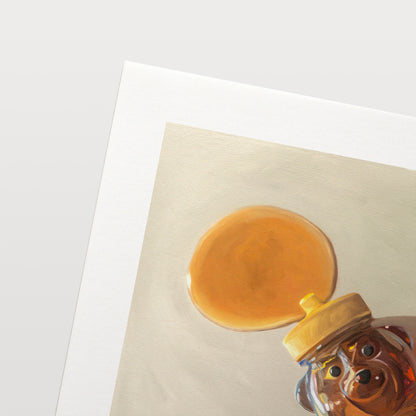 Spilled Honey Fine Art Print by Lauren Pretorius: a honey bear bottle that has tipped over and spilling its contents.