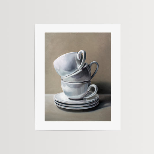 Stacked Cups and Saucers Fine Art Print by Lauren Pretorius: a precariously balancing stack of porcelain cups and saucers.