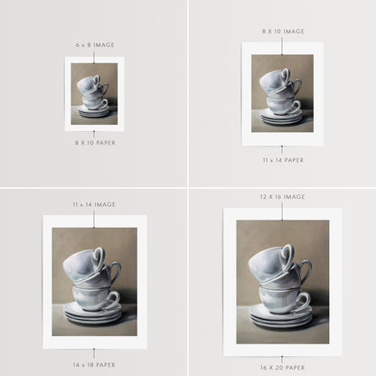 Stacked Cups and Saucers Fine Art Print by Lauren Pretorius: a precariously balancing stack of porcelain cups and saucers.