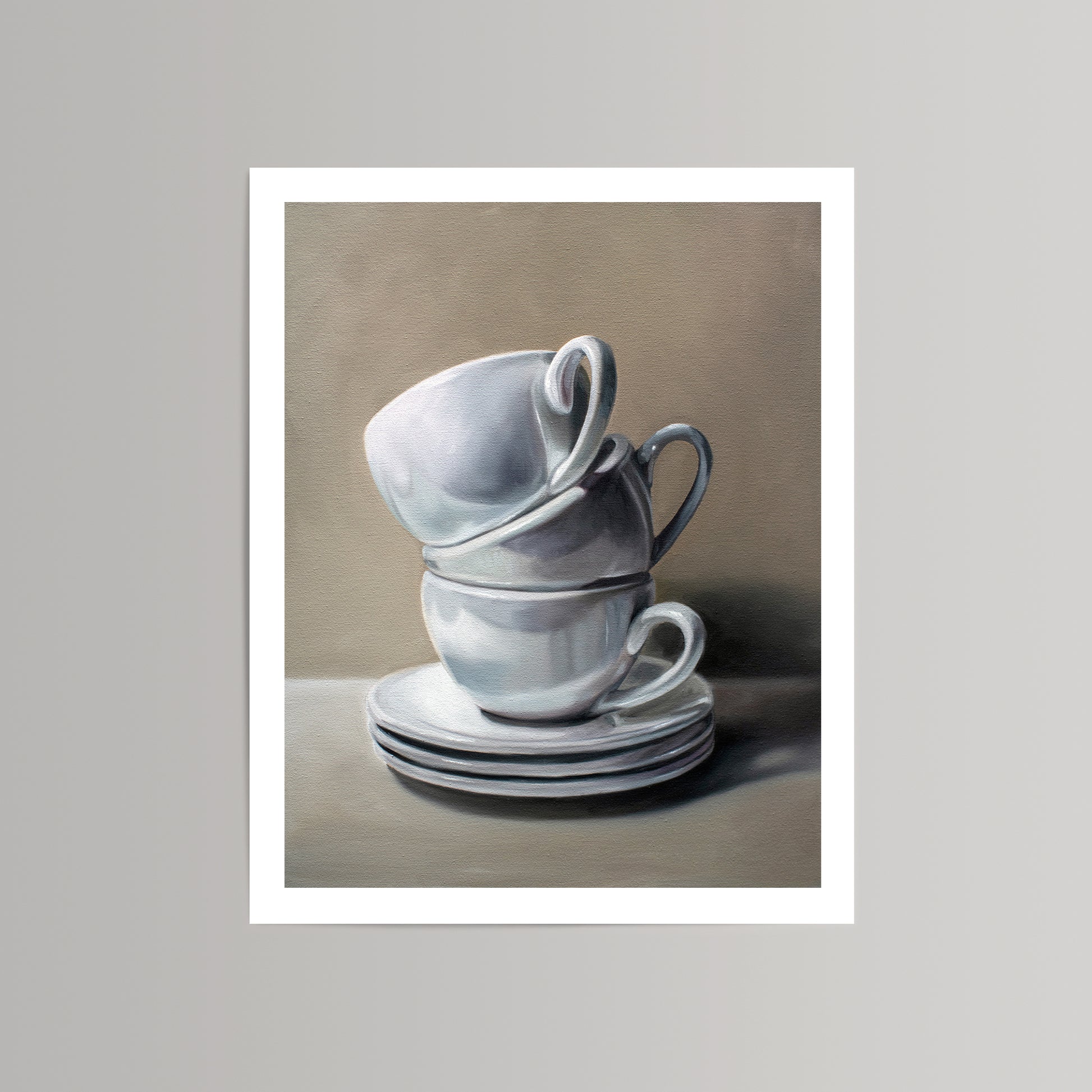Fine art print of three white ceramic cups and three saucers stacked against a warm gray background.
