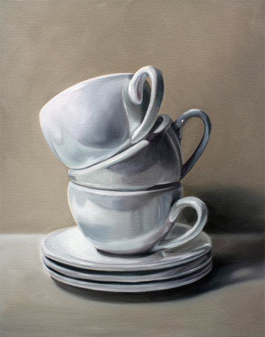 Fine art print of three stacked white ceramic teacups and saucers on a neutral background.