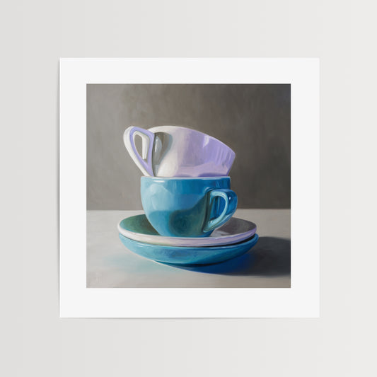 Stacked Cups & Saucers Fine Art Print by Lauren Pretorius: a stack of blue and white cups and saucers on a table.