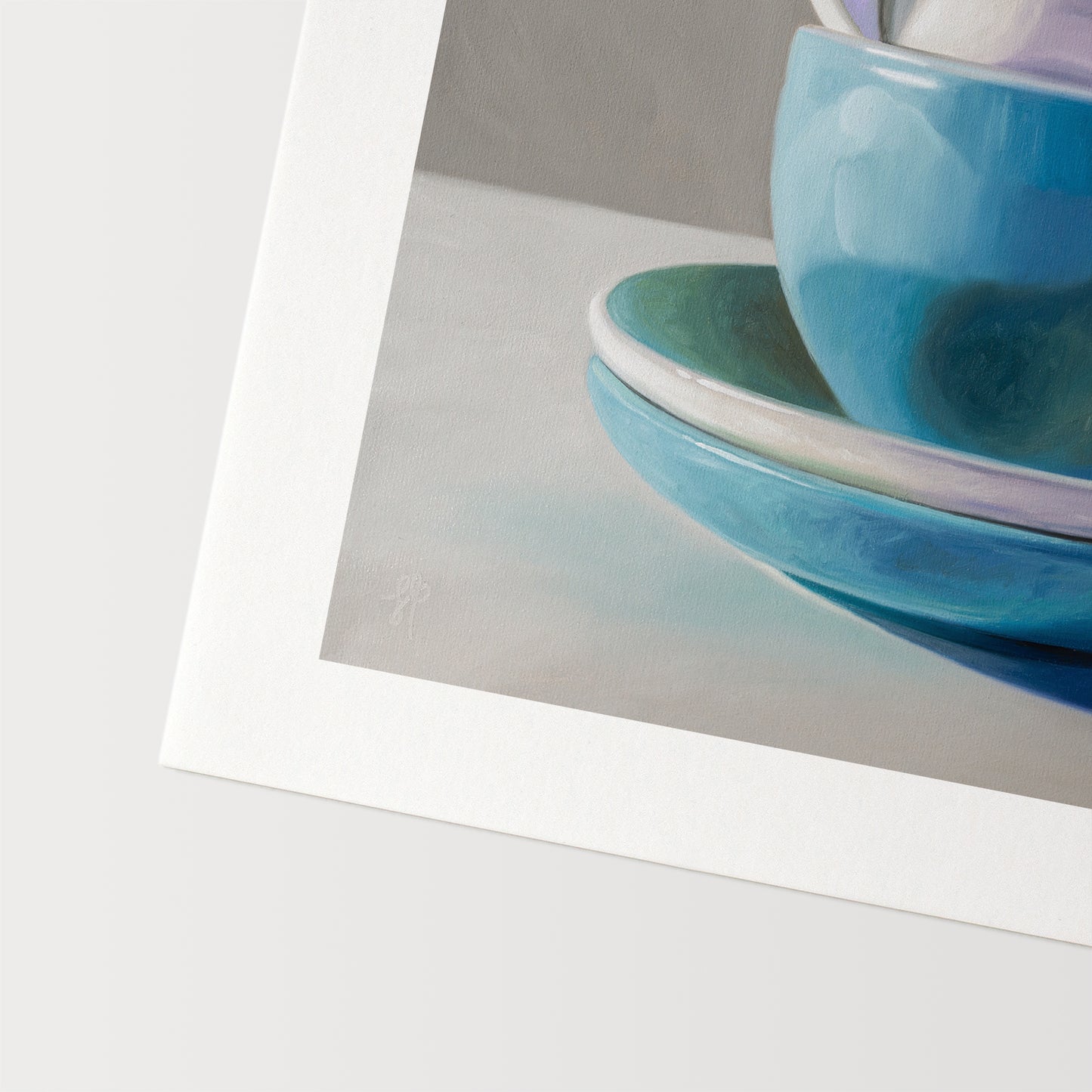 Stacked Cups & Saucers Fine Art Print by Lauren Pretorius: a stack of blue and white cups and saucers on a table.