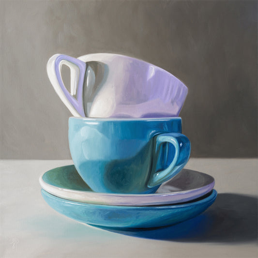 Stacked Cups & Saucers Fine Art Print by Lauren Pretorius: a stack of blue and white cups and saucers on a table.