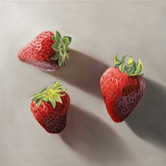 Vibrant fine art print of three realistic red strawberries with green caps on a light gray background.