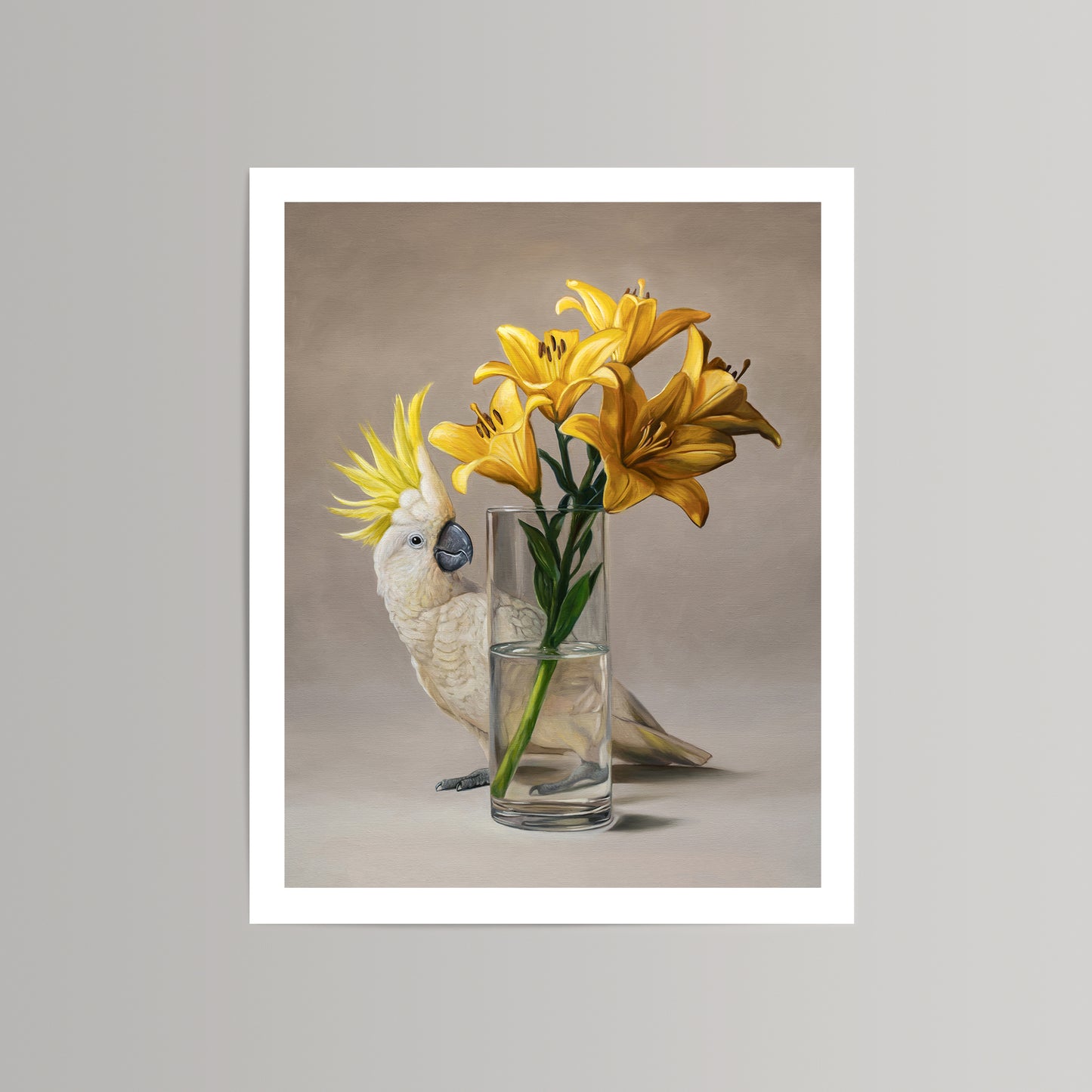 Fine art print of a white sulphur-crested cockatoo next to a vase of vibrant yellow lilies.