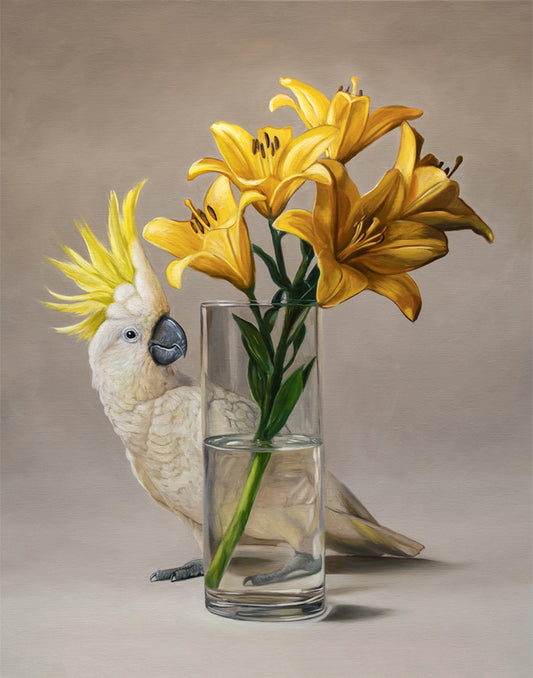 Fine art print of a white sulphur-crested cockatoo with yellow lilies in a clear glass vase.