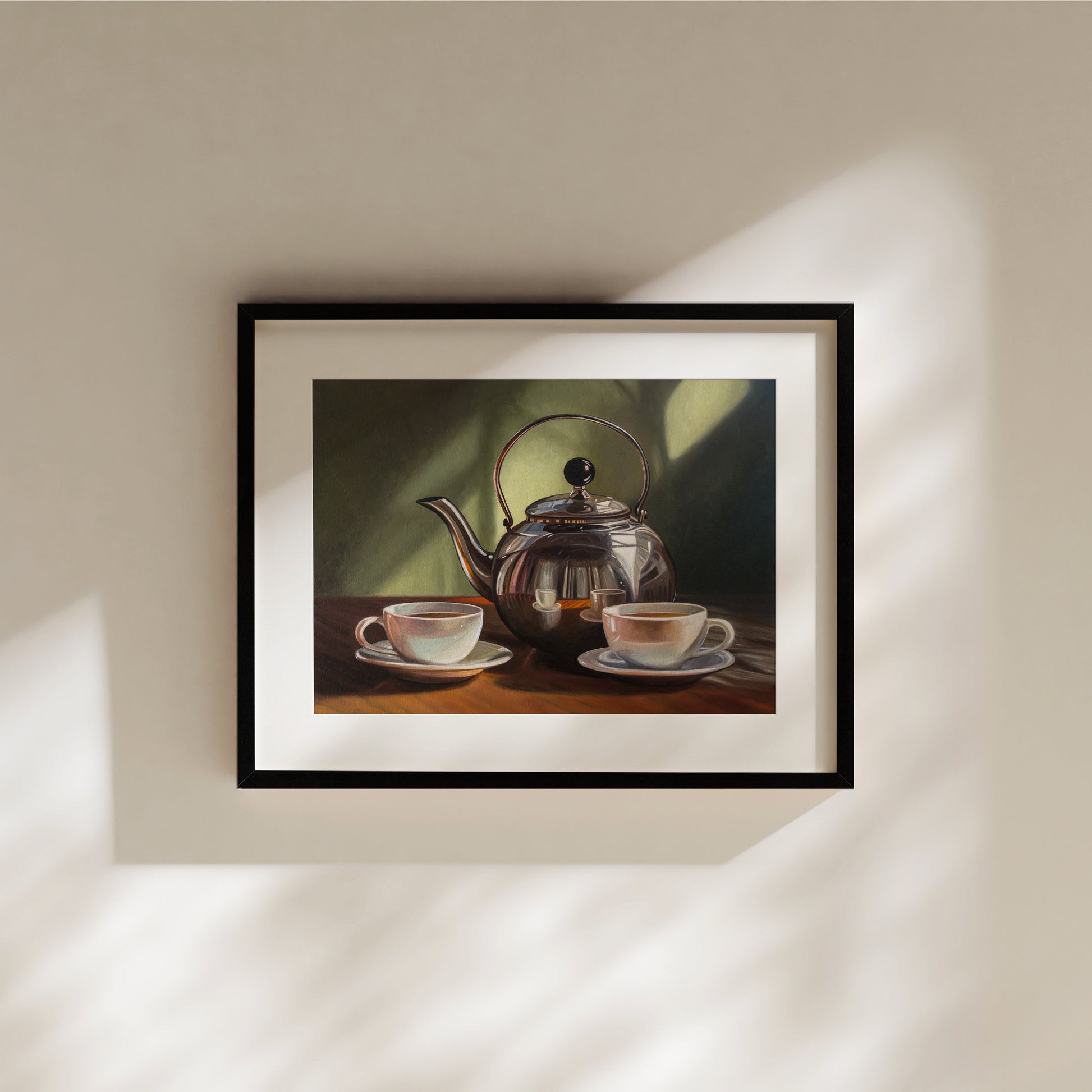 Tea for Two Fine Art Print by Lauren Pretorius: a silver tea kettle with a lid, placed on a table with two cups of tea in front. The background is in shadow with a hint of light.