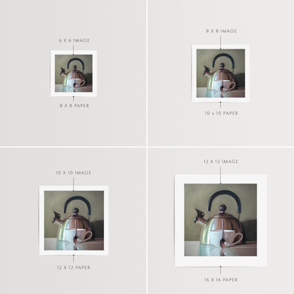 Tea Kettle and Coffee Cup Fine Art Print by Lauren Pretorius: a coffee cup resting next to a vintage tea kettle.is from a series tea kettles paired with various objects.