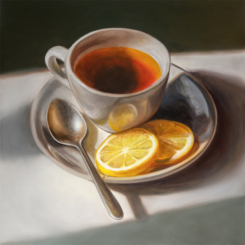Tea with Lemons Fine Art Print by Lauren Pretorius: a cup of tea with lemon slices on a plate, accompanied by a spoon, against a light background.